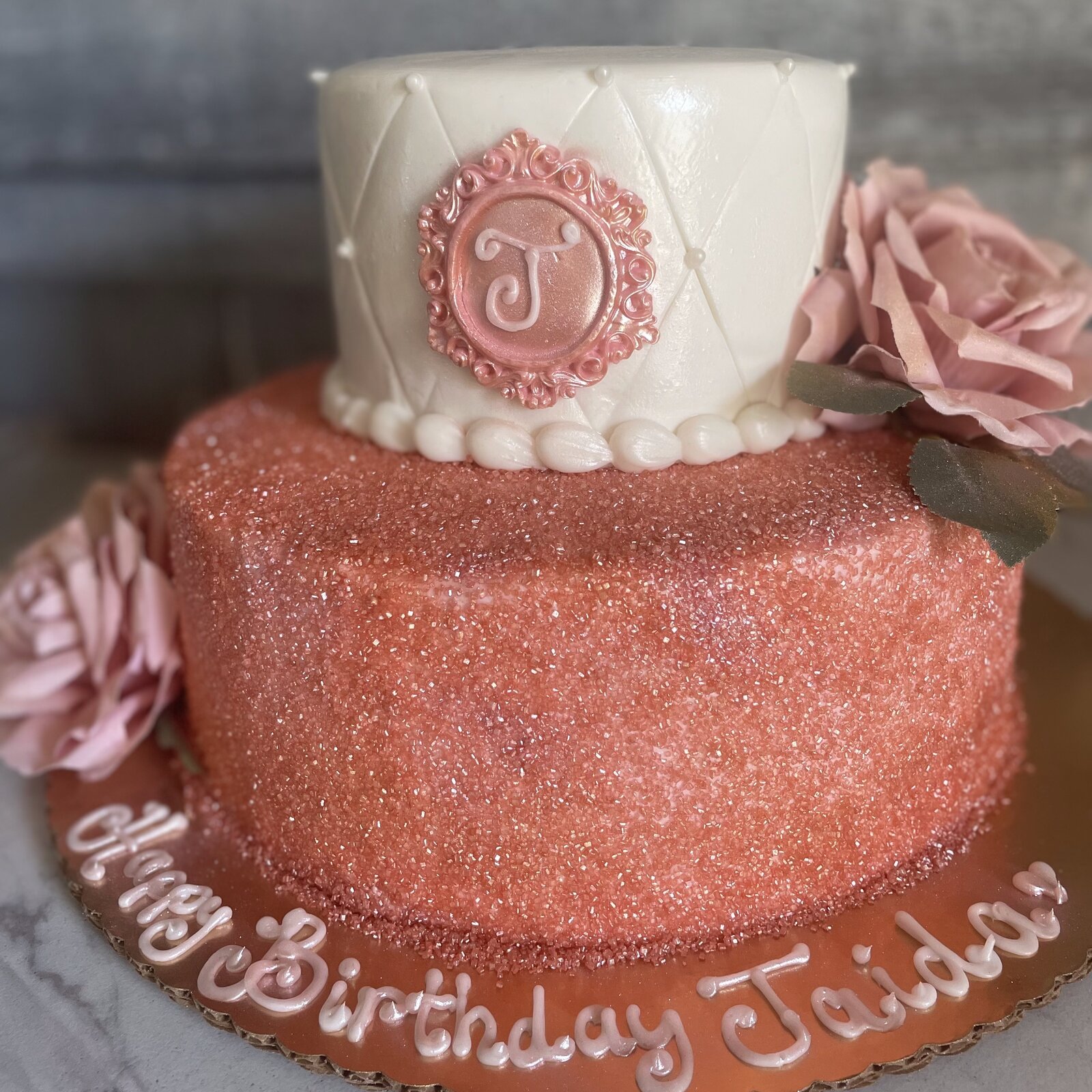 Rose gold monogram birthday cake at Lu's